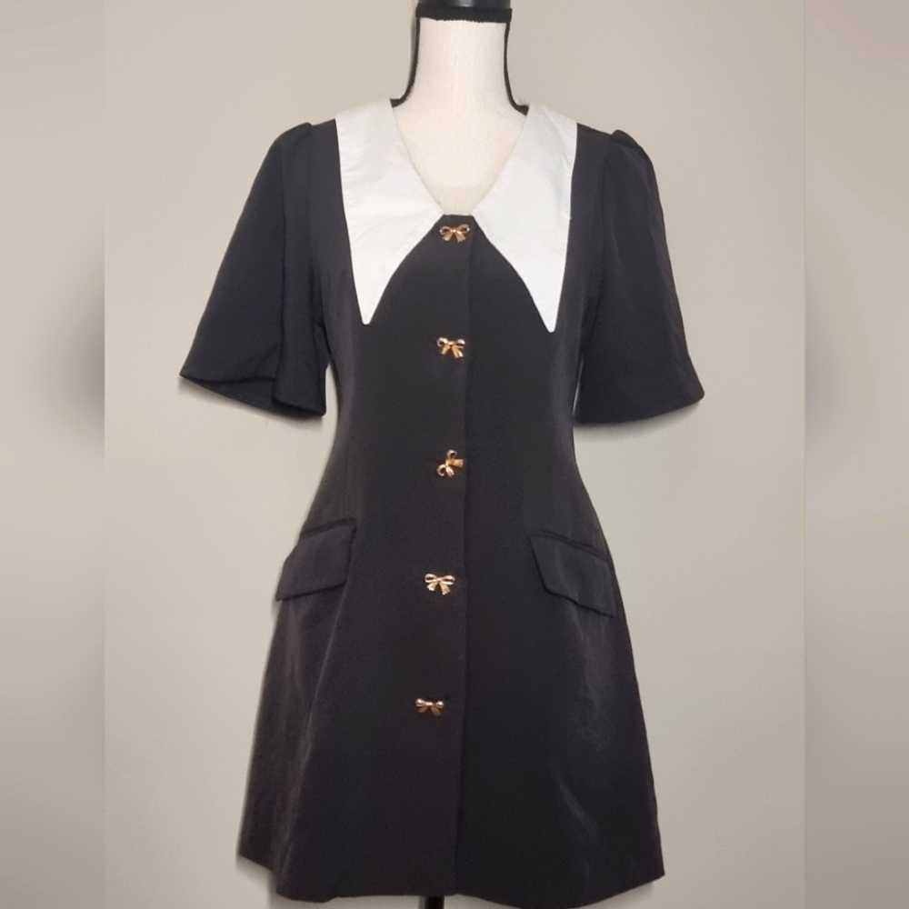 Super cute black dress with metal bow buttons